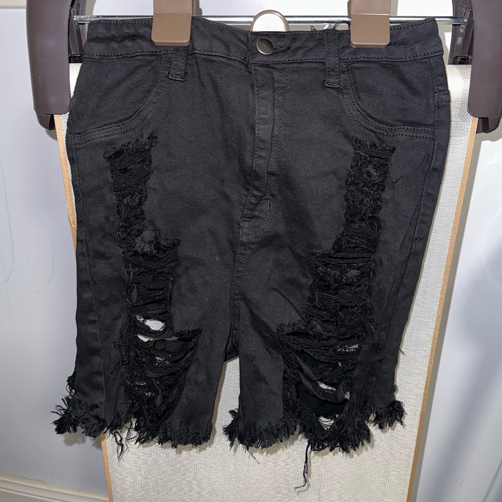 Black ripped jeans.